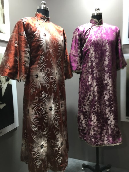 two loose fitting, embroidered qipao dresses