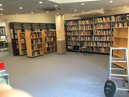 library room with shelving in disarray