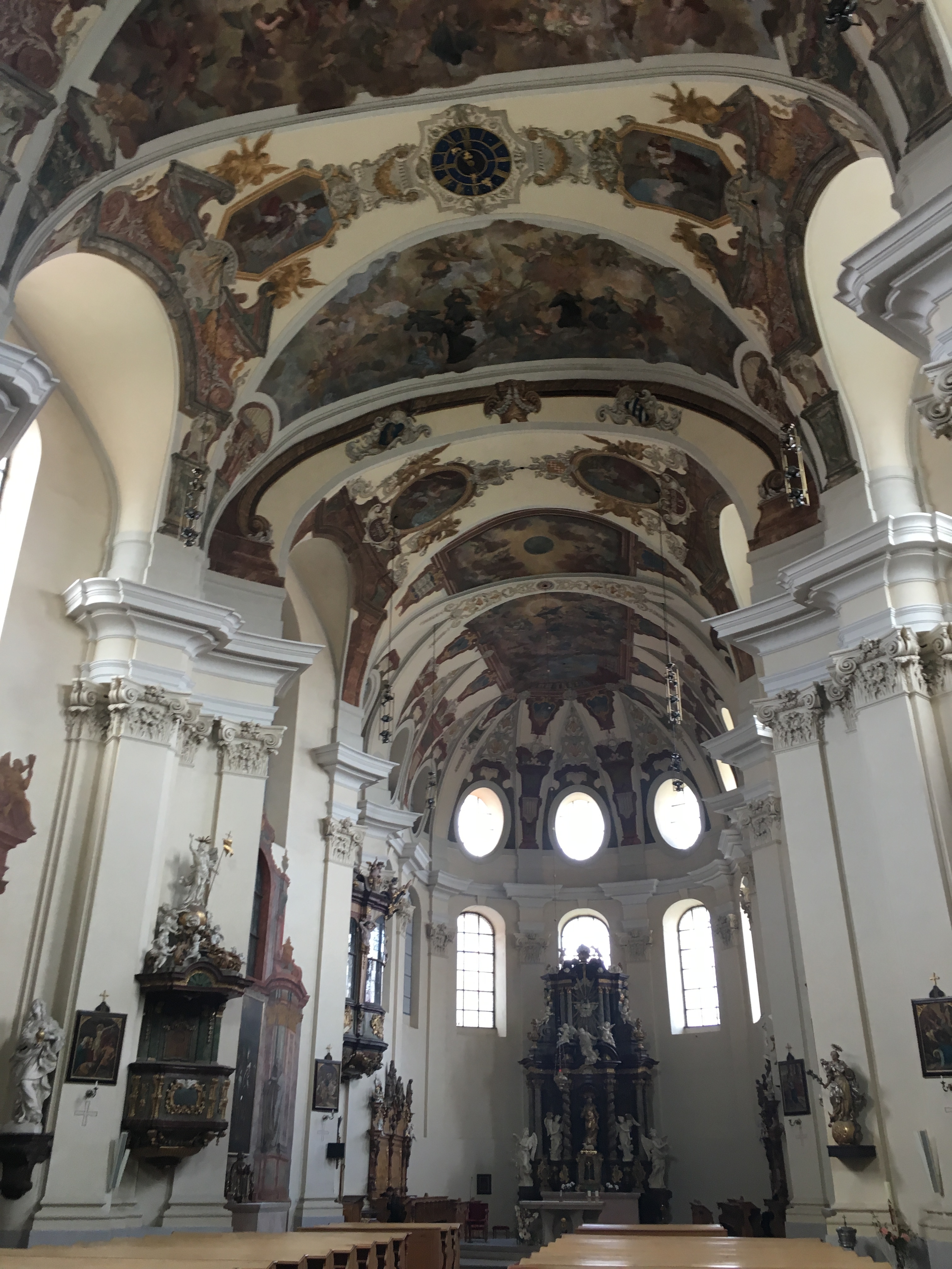 inside of the church with vaulted painted ceiling