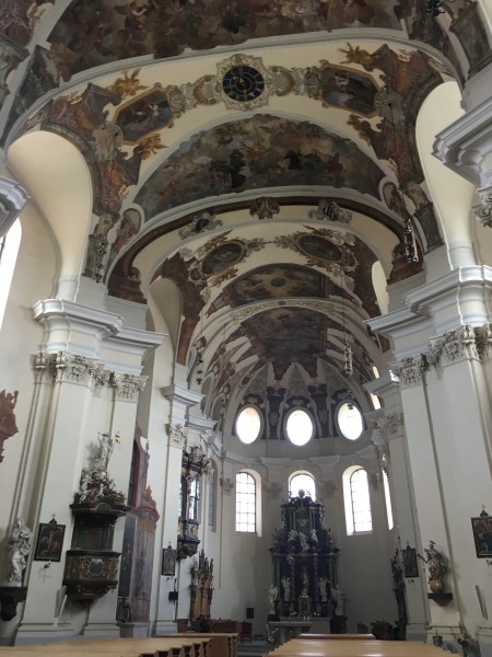 inside of the church with vaulted painted ceiling