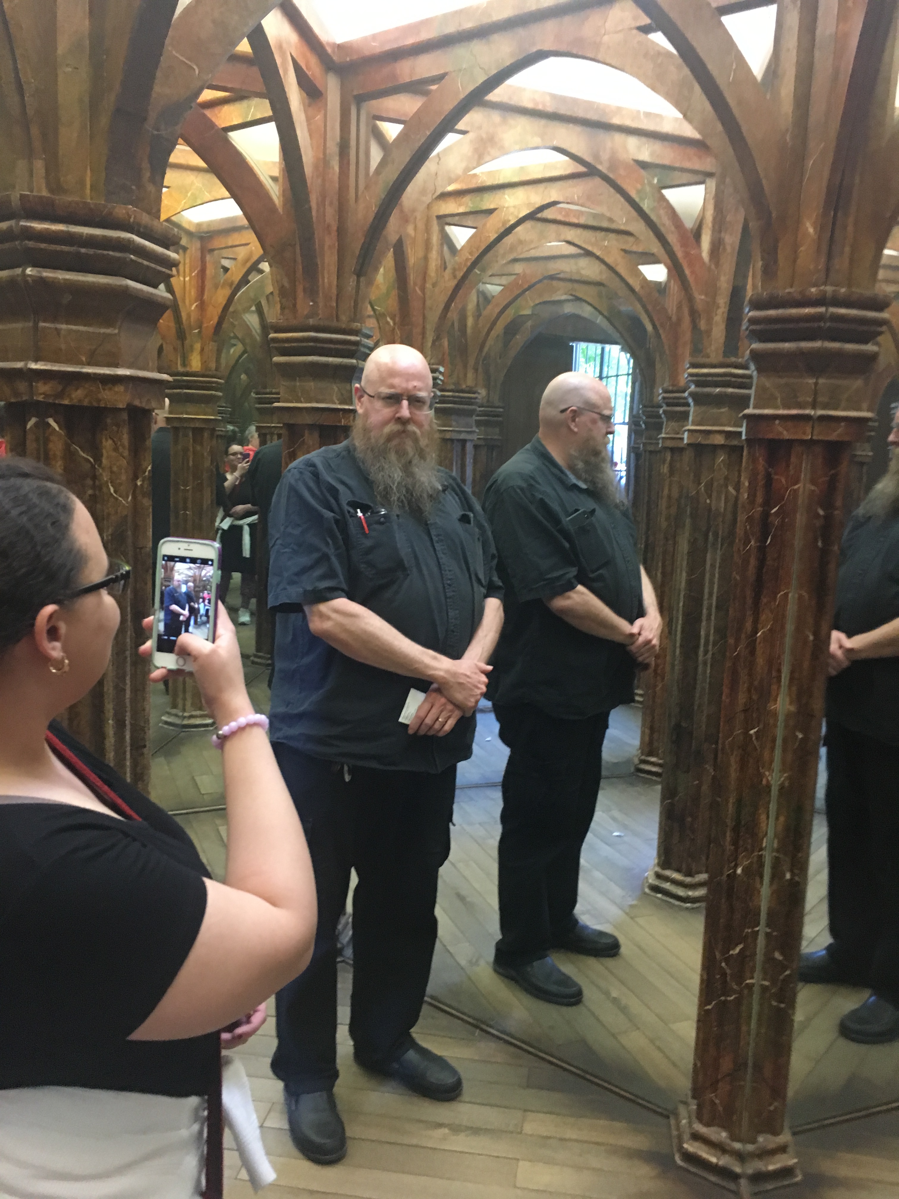 posing for a picture in a hall of mirrors
