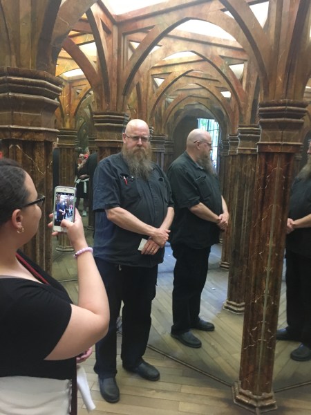 posing for a picture in a hall of mirrors