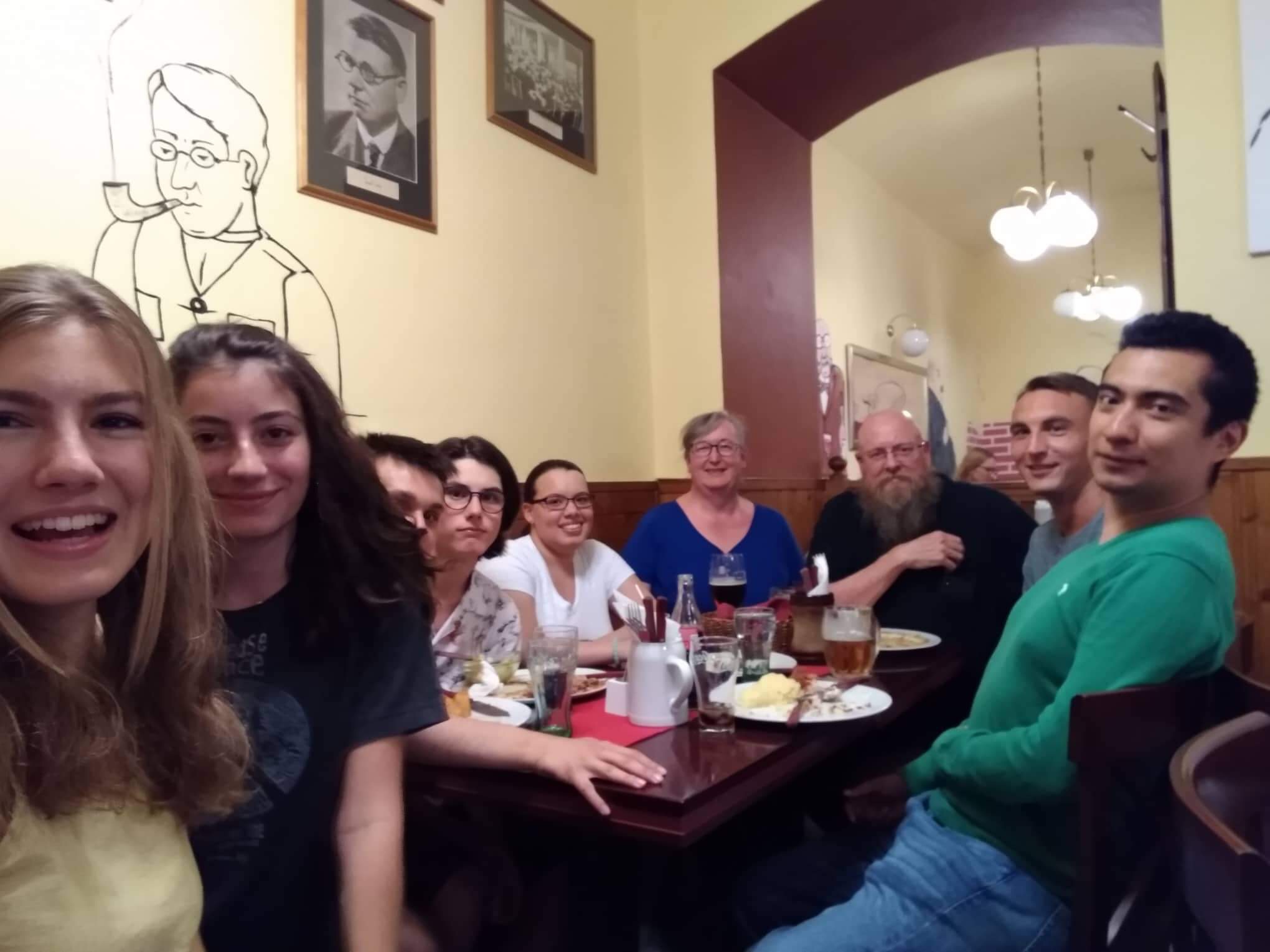 nine people at a pub table