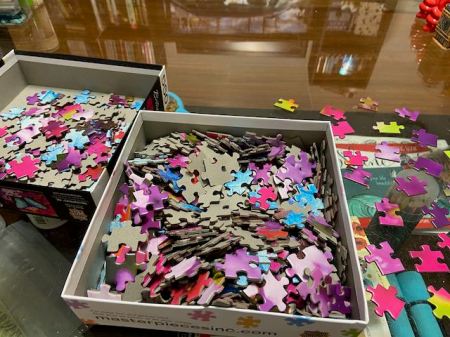 jigsaw puzzle pieces in a box