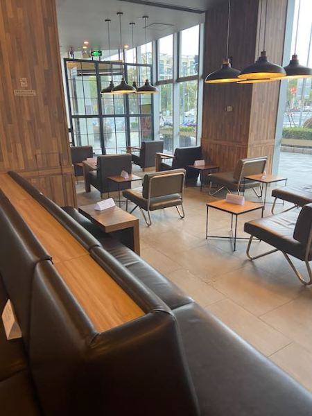 coffee shop with chairs arranged singly to keep people from sitting together or face to face