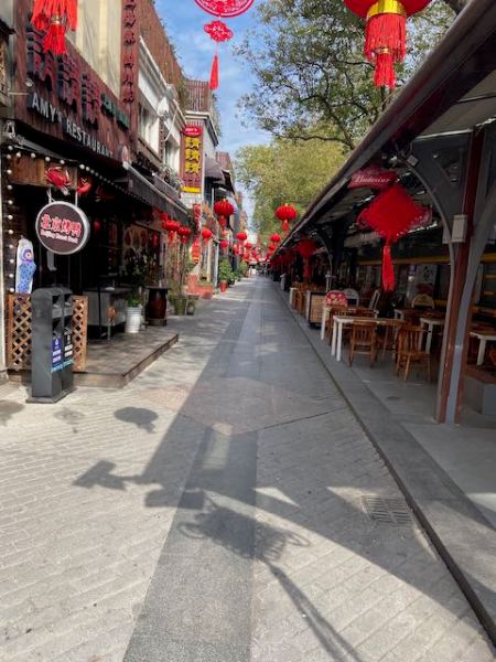 pedestrianized area with restaurants, but no customers in sight