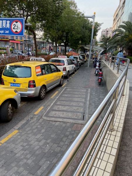 line of taxis waiting in front of a major grocery store