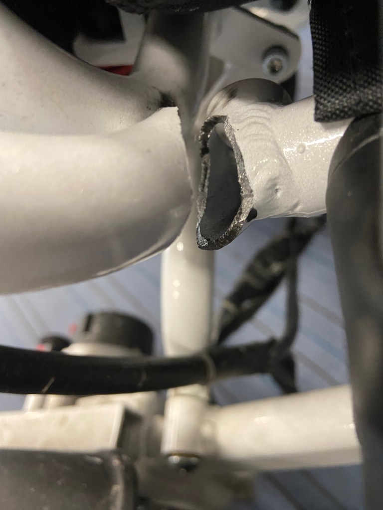 close up of broken frame of a wheelchair