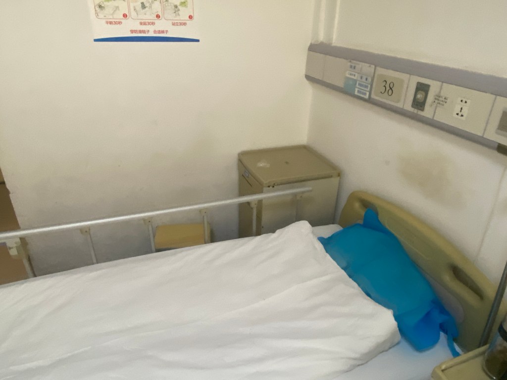 old hospital bed and scuffed walls